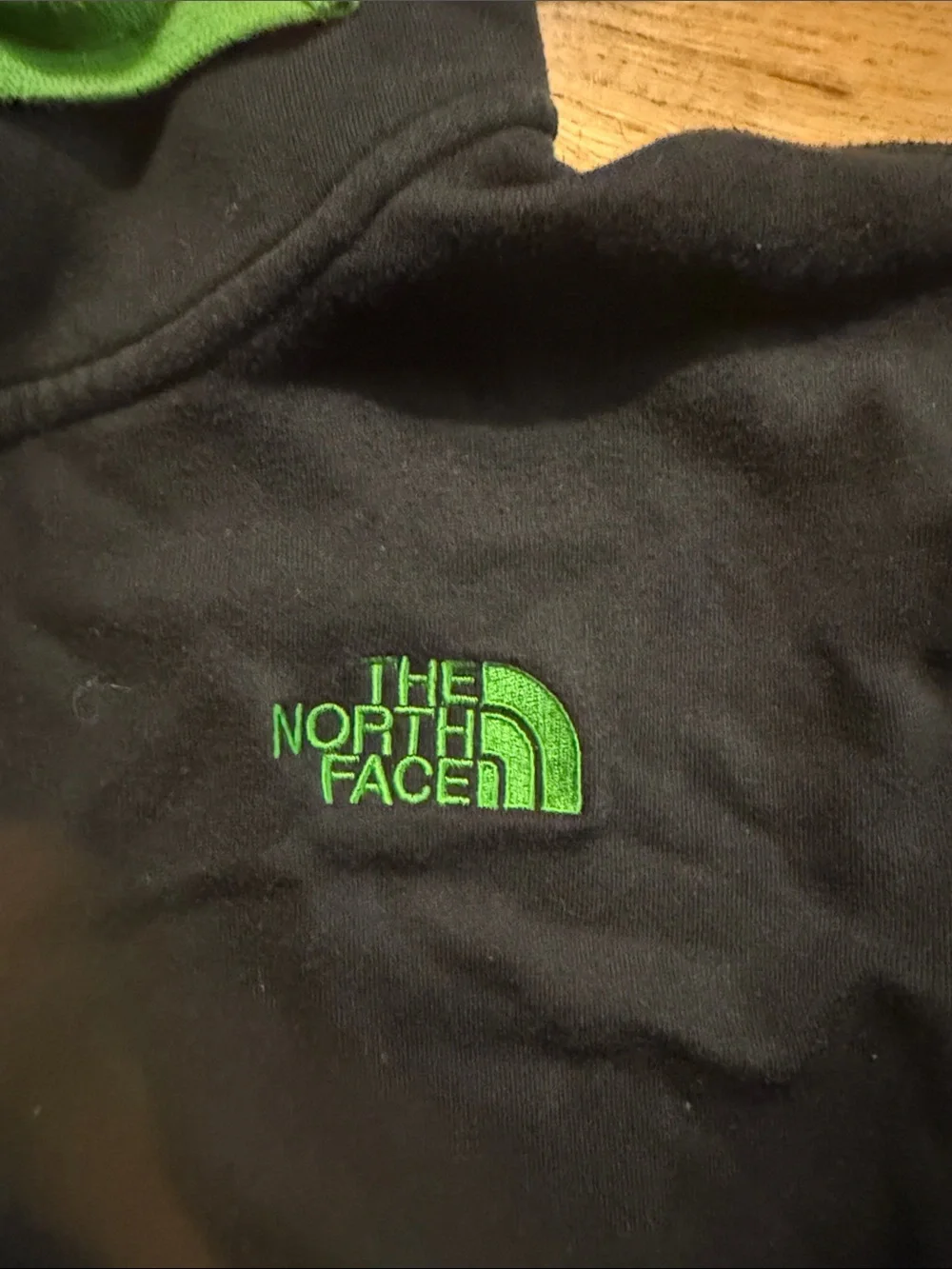 The North Face Black Hoodie with Green Accents